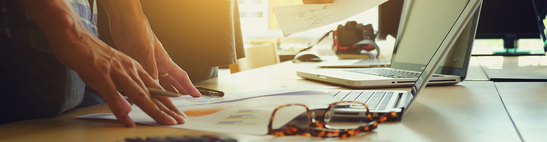 The above view of young man discussing data at meeting fiduciary